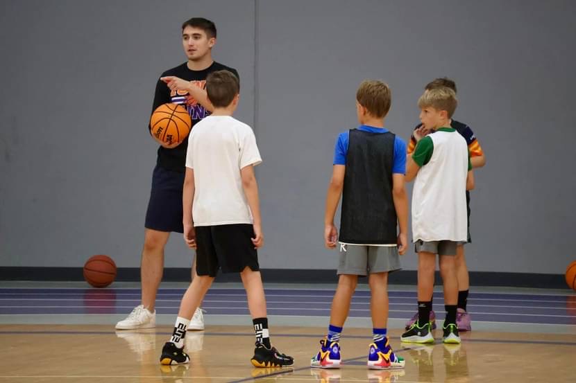 Andrew Curran teaching young players in the gym